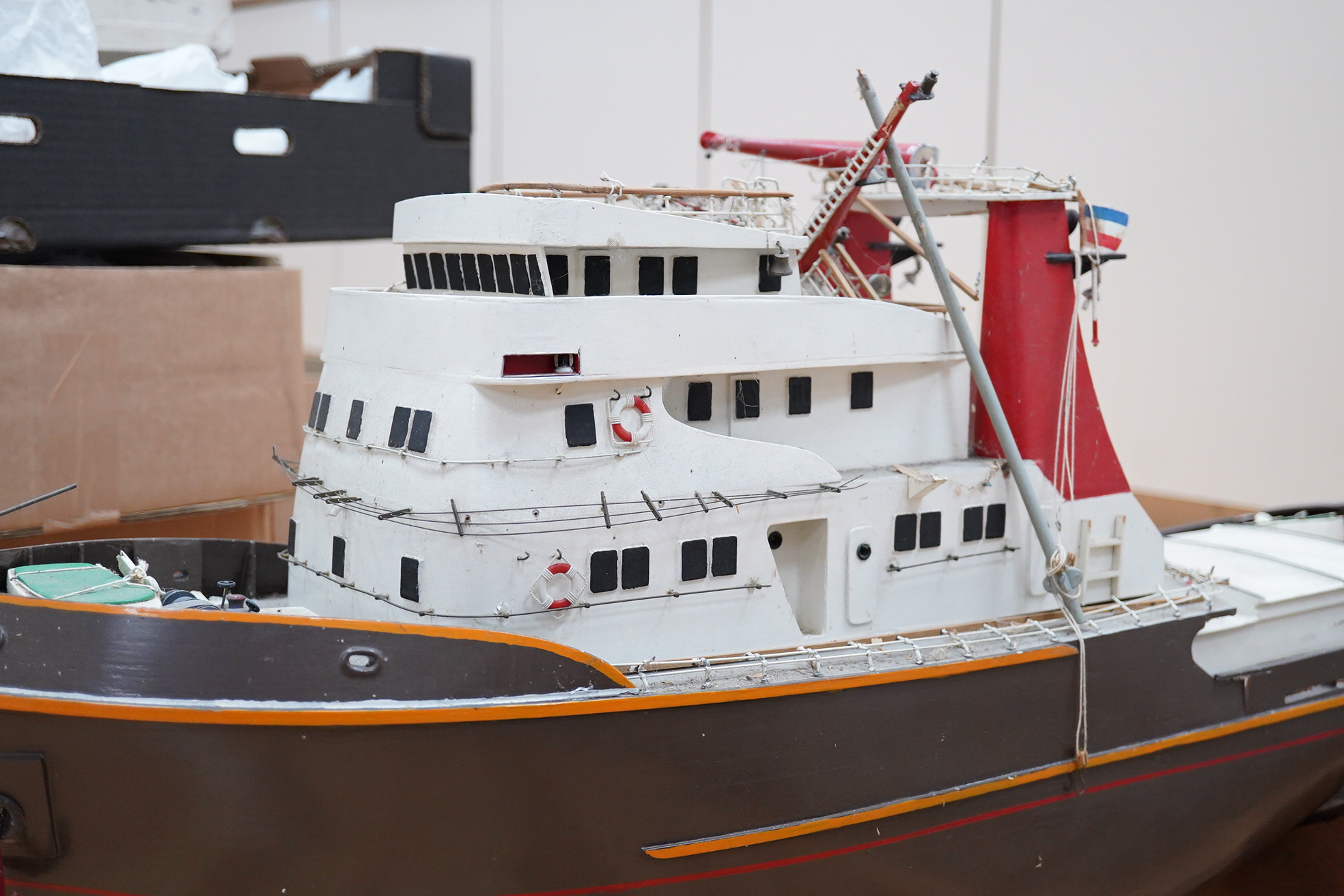 A model of the tugboat Amsterdam, probably built from a kit as a pond yacht, and powered by an electric motor, length of hull approx 103cm, of primarily painted wood construction